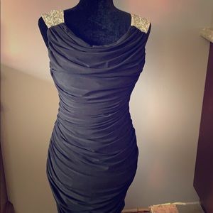 Black cocktail length dress with crystal straps.